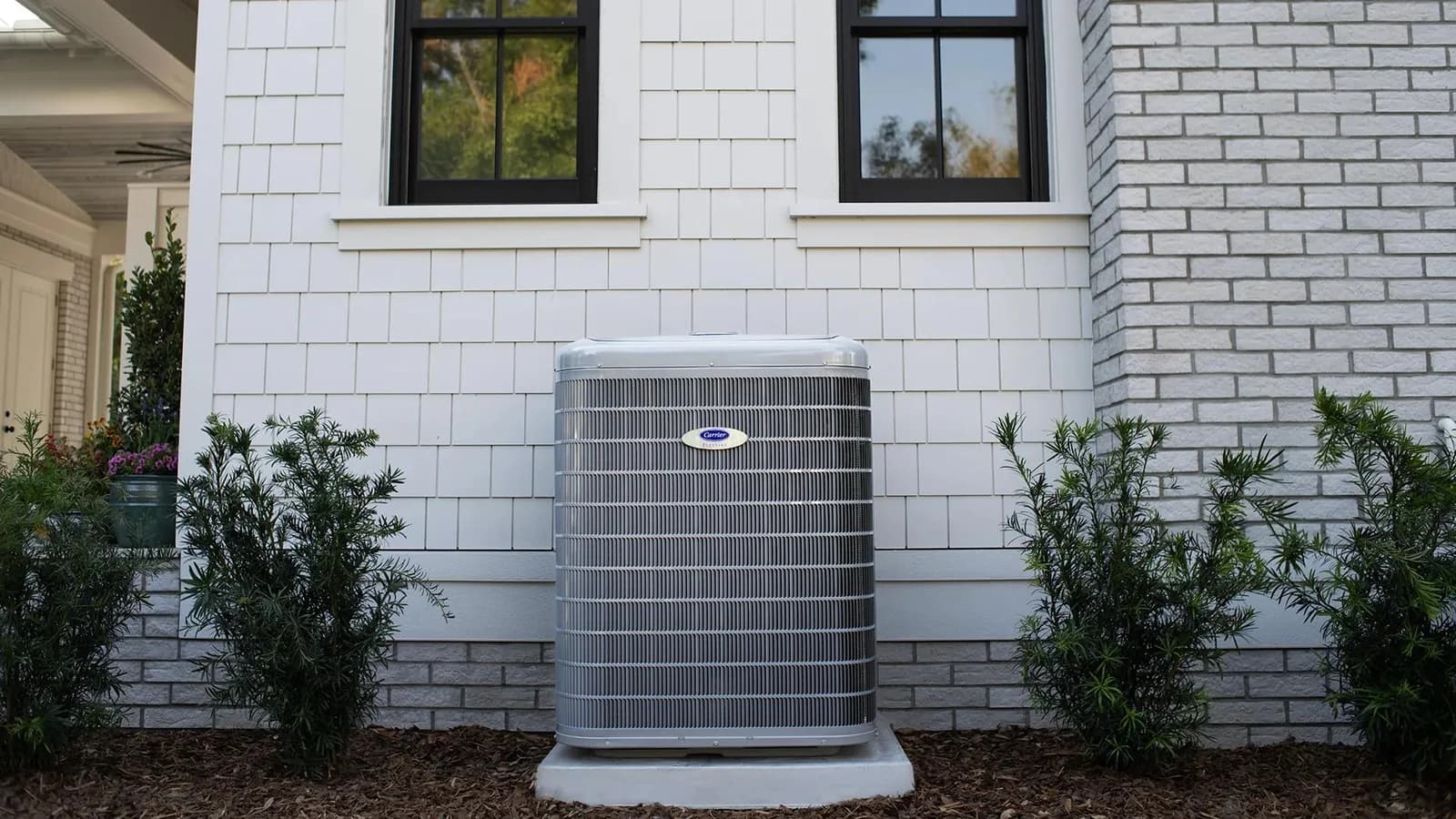 Carrier air conditioner installed beside a home
